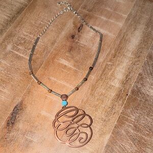Elegant Gold and Turquoise color stone Brighton Scribble Pendant Necklace.